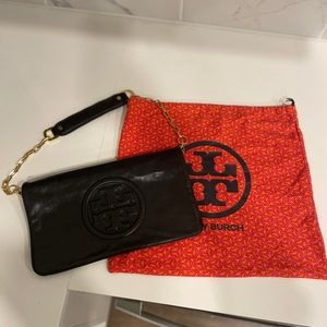 All black and gold chain Tory Burch. The reallllll one